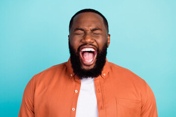 Wall Mural - Photo of young african man angry mad shout trouble mistake loud isolated over turquoise color background