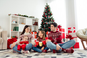 Sticker - Photo of shiny sweet big family wear christmas sweaters sitting under tree drinking hot tea smiling indoors room home house