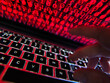 © Andrew Brookes/Westend61 - Hacker coding a computer virus infecting a laptop