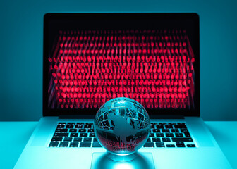 Globe illustrating the Americas on a laptop computer with screen been infected by a cyber attack