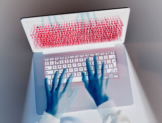 Hands of hacker coding computer virus on laptop