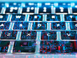 © Andrew Brookes/Westend61 - Double exposure of a laptop computer showing electronic components under the keyboard