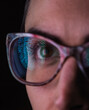 © Andrew Brookes/Westend61 - Woman with a reflection of a finger print on her glasses to represent identity and access
