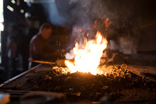 Forge In Workshop With Blacksmith In Background