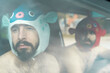 © VITTA GALLERY/Westend61 - Portrait of gay couple in a car wearing animal hats