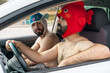 © VITTA GALLERY/Westend61 - Gay couple in a car wearing animal hats