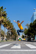© VITTA GALLERY/Westend61 - Spain, Barcelona, man in the city jumping on the street