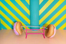Oversized Donuts As Barbell At An Indoor Theme Park