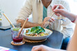 © VITTA GALLERY/Westend61 - Close-up of people having healthy lunch in a restaurant