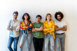 © VITTA GALLERY/Westend61 - Portrait of confident group of friends standing at a wall