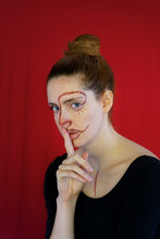 Portrait Of Young Woman With Paint On Her Face