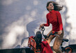 © LOUIS CHRISTIAN/Westend61 - Carefree young woman riding a rental bike