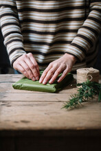 Woman's Hands Wrapping Present