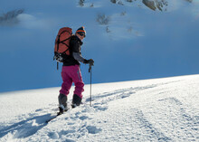 Switzerland, Bagnes, Cabane Marcel Brunet, Mont Rogneux, Woman Ski Touring In The Mountains
