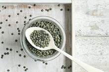 Jar Of Green Lentils On Wooden Table Seen From Above