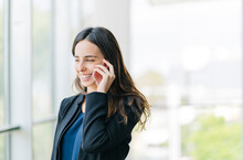 Smiling Businesswoman Talking On The Phone