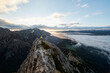 © Christian Vorhofer/Westend61 - Austria, Tyrol, Gnadenwald, Hundskopf, male climber standing on rock in the morning light
