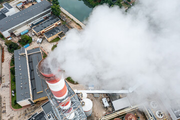 Wall Mural - Air pollution with smoke from a chimney close-up. Industrial zone in the city, View from the top