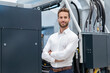 © Daniel Ingold/Westend61 - Portrait of a confident businessman in a modern factory