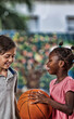 © jovannig - Young children playing basketball at school
