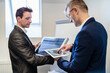 © Daniel Ingold/Westend61 - Two businessmen in office with solar cell and tablet