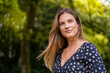 © Daniel Ingold/Westend61 - Smiling young woman in park