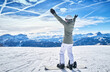 © Dirk Kittelberger/Westend61 - Mature woman with snowboard on ski slope with raised arms