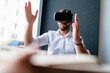 © Daniel Ingold/Westend61 - Businessman with architectural model in office wearing VR glasses