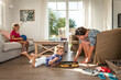 © Ega Birk/Westend61 - Mother playing with daughters in living room