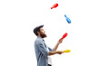 Profile shot of a juggler juggling with clubs
