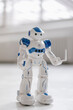 © Westend61 - Miniature robot figurine holding laptop