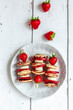© Westend61 - Plate of mini pancakes with strawberries and bananas
