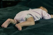 A Baby Sleeping In A Dangerous Position. Sudden Infant Death Syndrome.