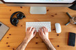 © William Perugini/Westend61 - Hands of man, working from home, view from above of desk with mobile devices an coffee maker