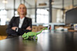 © Gustafsson/Westend61 - Mature businesswoman with chameleon figurine on desk in office