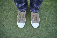 UK, England, London, Shoes Of Person Standing On Green Grass