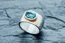 Silver Ring With Topaz In Gold Setting On Slate