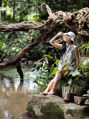 Young asian woman feel relax at log cabin in countryside