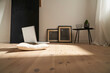 © Philipp Dimitri/Westend61 - Laptop on cushion and wooden floor in a modern room