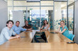 © Andreas Pacek/Westend61 - Business people sitting at conference table in office
