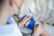 © philipp nemenz/Westend61 - Close-up of doctor taking blood pressure of patient in medical practice