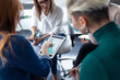 © JOSEP SURIA/Westend61 - Businesswomen using charts on digital tablet during meeting in an office