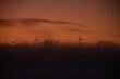 © Sebastian Kanzler/Westend61 - Spain, Province of Cadiz,ÔøΩTarifa, Silhouettes of wind turbines standing against moody sky at foggy dawn