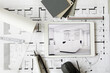 © Rainer Berg/Westend61 - ArchitecturalÔøΩblueprints and digital tablet displaying modern showcase interior