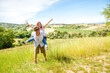 © ¬© Flavia Morlachetti/Westend61 - Happy mid-adult couple enjoying countryside on sunny day