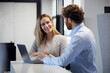 © Rainer Berg/Westend61 - Businessman and businesswoman working together with laptop in office