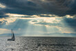 © Michael Runkel/Westend61 - Sailing boat before the sun breaking through the clouds above the Amur in Vladivostok, Russia