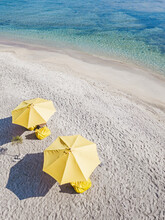Drone Shot Of Yellow Parasols At Beach During Sunny Day, Gili-Air Island, Indonesia