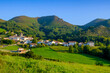 © Lisa Bahnm√ºller/Westend61 - Spain, Navarre, Zugarramurdi, Village at foot of green forested hills