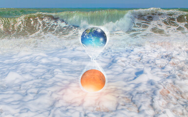 Poster - Global warming concept - Planet Earth is becoming a dead planet like Mars is covered with sea - Hourglass inside glass globe 
